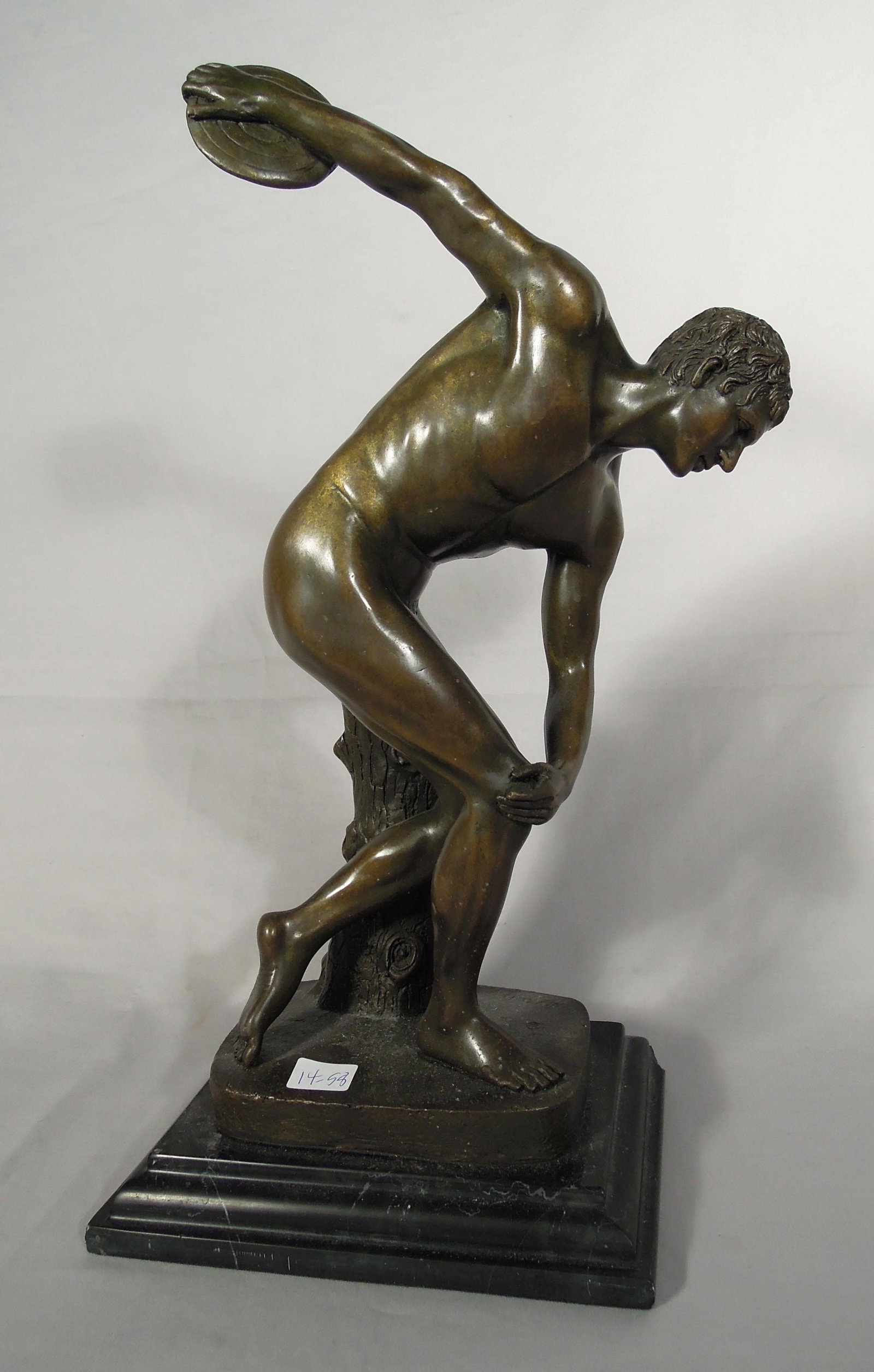 BRONZE SCULPTURE OF DISCUS THROWER: Nude man throwing disc. Fine patina. Signed Myron. Note chip in one cornor of marble base. 15 1/4" High.