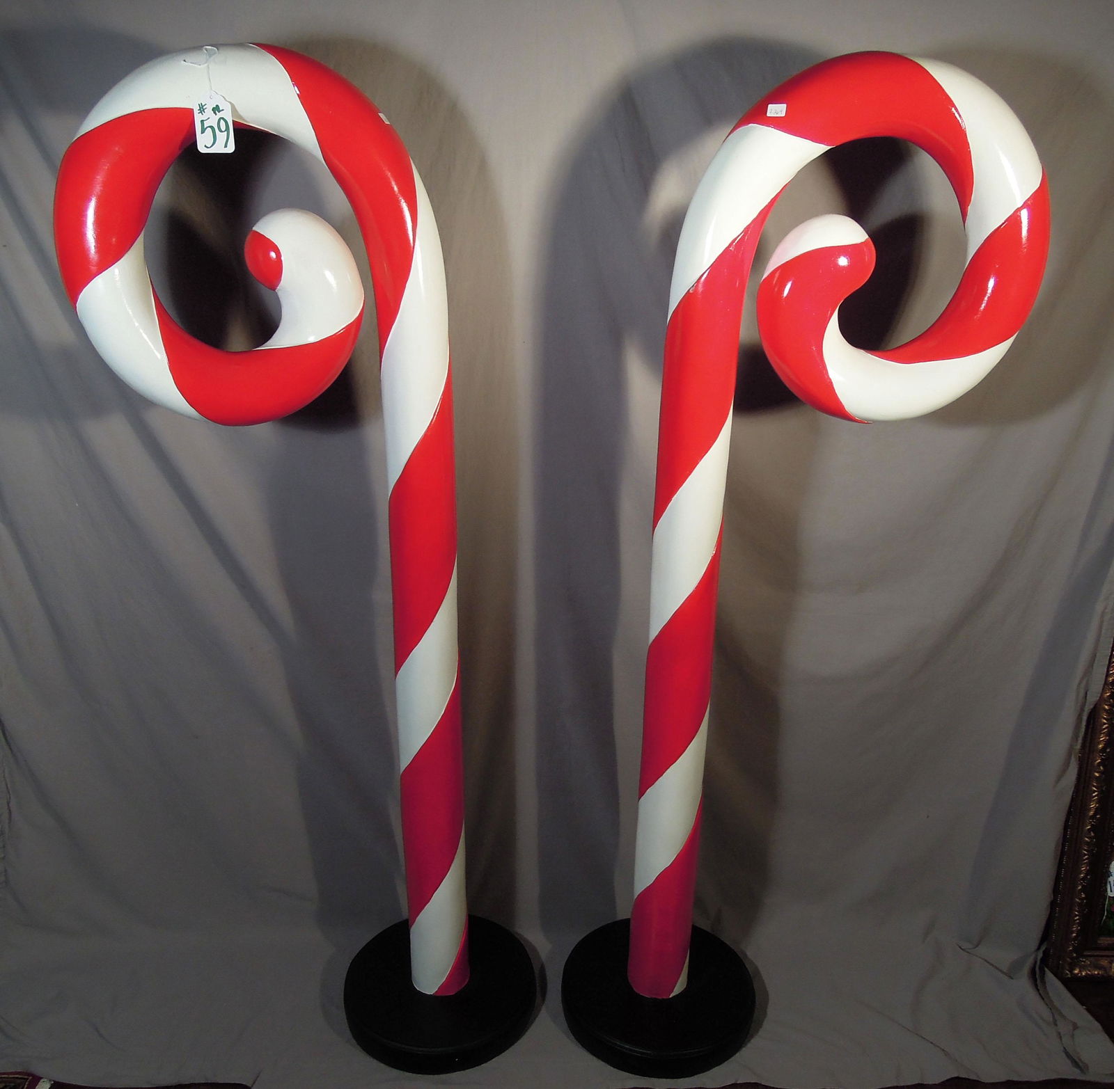 PAIR LARGE HAND PAINTED COMPOSITION CANDY CANES: Indoor or outdoor. 62" high.