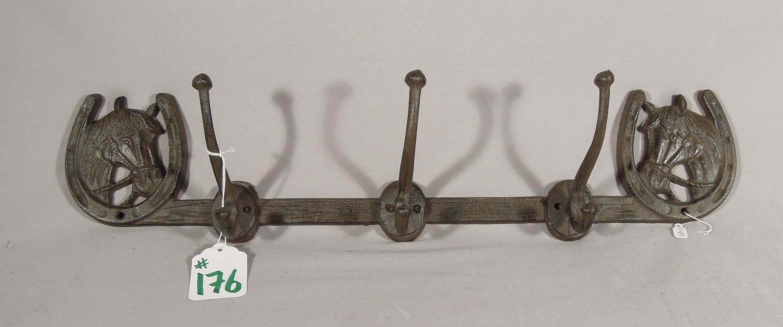 HEAVY CAST IRON HORSE MOTIF TRIPLE HOOK RACK: 23" long.
