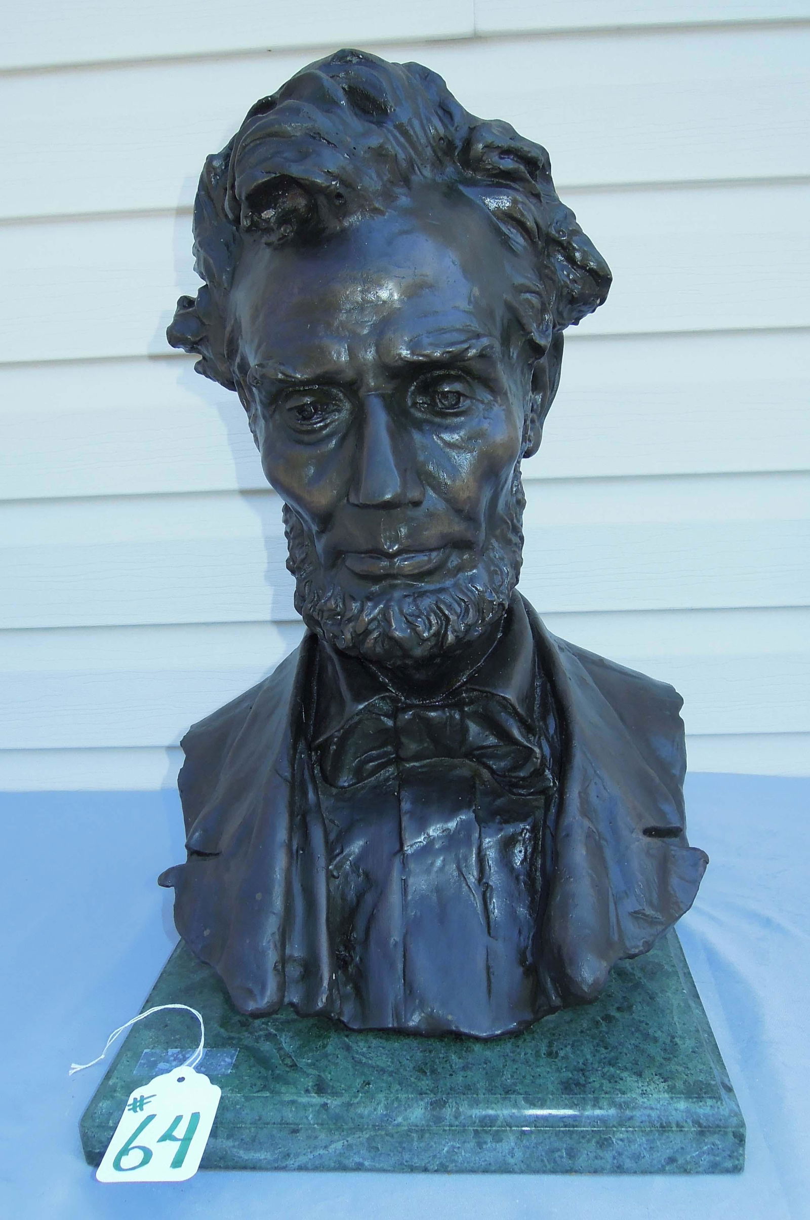 GEORGE EDWIN BISSELL (1839-1920) AMERICAN: Bronze bust of Abraham Lincoln. Signed Geo E. Bissell. Very fine detail. Green marble base. 20" high, 12 1/2" wide.