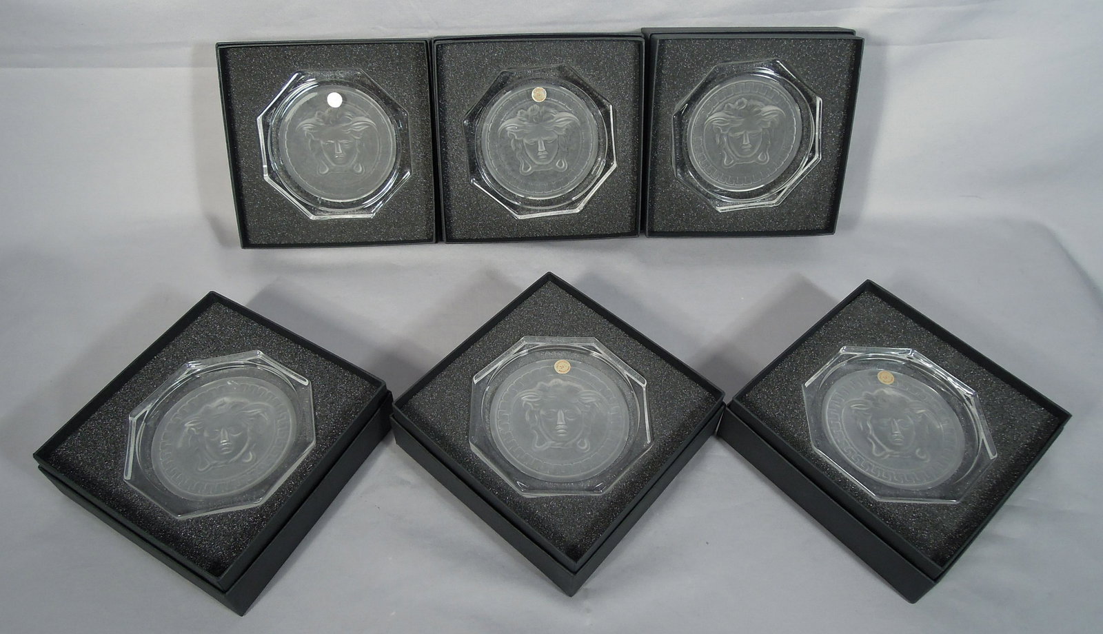 GROUP OF SIX ROSENTHAL VERSACE "MEDUSA" COASTERS: All signed and with original boxes.