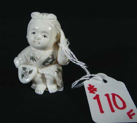CHINESE CARVED IVORY NETSUKE: F. Young girl holding mirror.