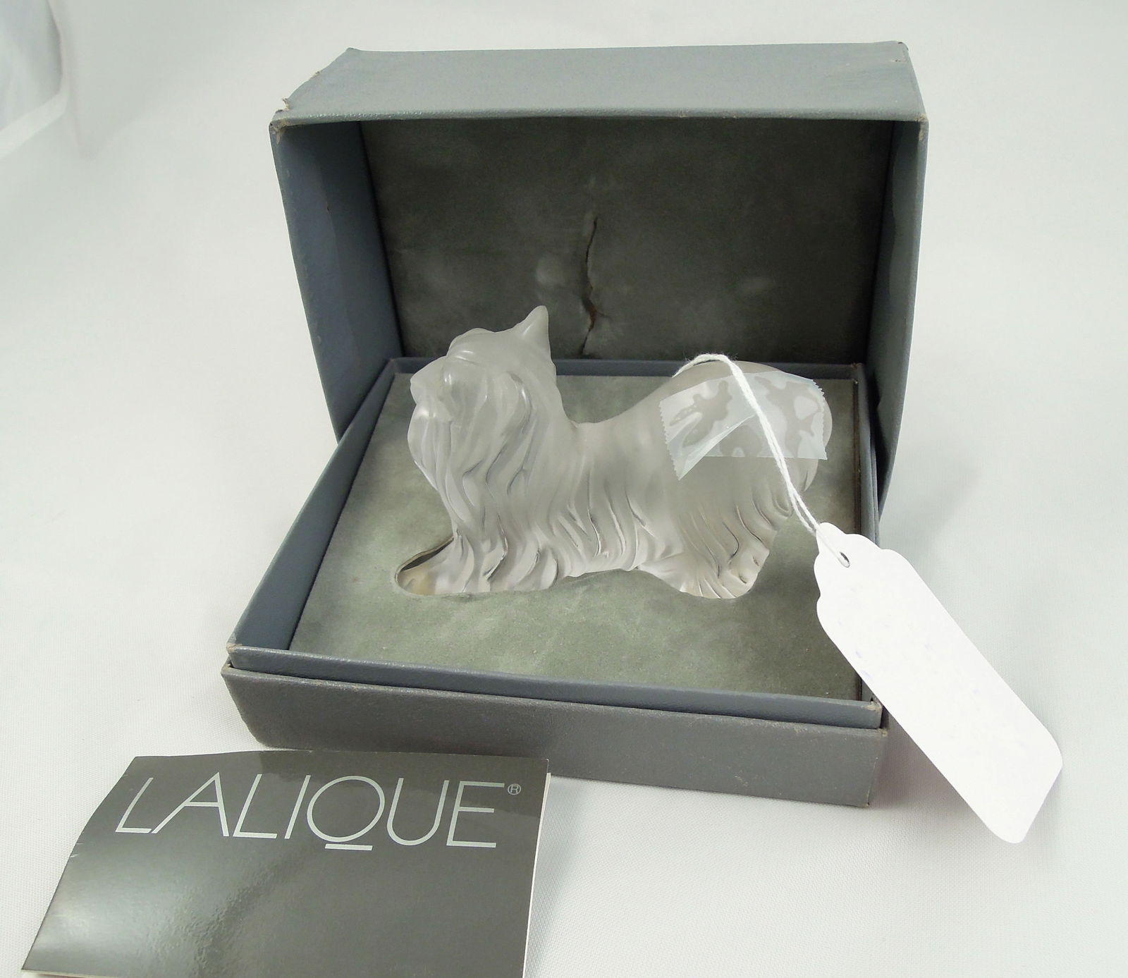 FRENCH LALIQUE CRYSTAL SCULPTURE OF YORKIE "SUPER BOY": Signed on base. Excellent condition. Original box. 3" high, 4 1/2" long.