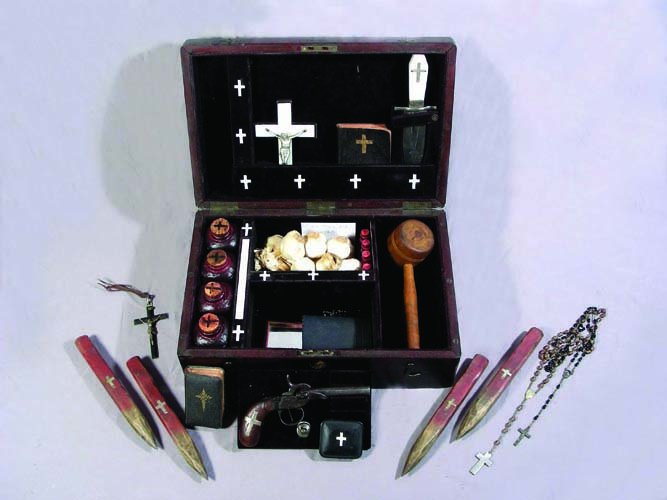 VERY UNUSUAL 19TH CENTURY VAMPIRE SLAYING KIT: VERY UNUSUAL 19TH CENTURY VAMPIRE SLAYING KIT (SEE PHOTO) A 19th Century wooden box with brass inlay. Center plaque on lid engraved “Nosferatu”. Box opens to reveal: 4 bottles of sealed holy water