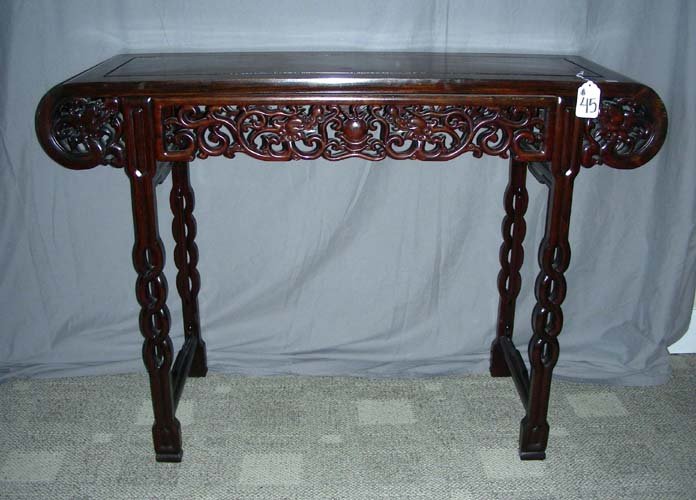 OLD HAND CARVED CHINESE ROSEWOOD ALTER TABLE: OLD HAND CARVED CHINESE ROSEWOOD ALTER TABLE Open scroll work on legs and apron. 33" high, 4' wide, 16 1/2" deep
