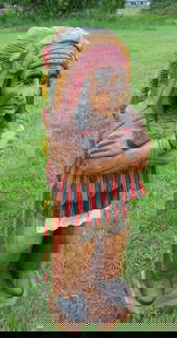 HAND CARVED WOODEN INDIAN: Indian in full garb. Hand painted. 41" high.