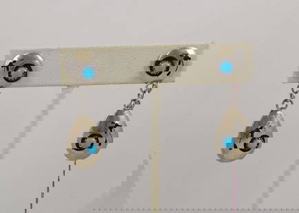 PAIR VINTAGE NATIVE AMERICAN STERLING SILVER & TURQUOISE EARRINGS: An open work earring with turquoise. 1 1/2" long.