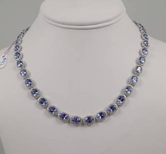 LADIES 14K W.G., TANZANITE & DIAMOND ETERNITY NECKLACE: A 17" eternity necklace with oval sections. Each section with an oval faceted tanzanite. Total tanzanite weight 31.78 cts. Each tanzanite surrounded by a single row of full cut round diamonds