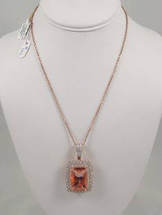 SPECTACULAR LADIES 18K ROSE GOLD, MORGANITE & DIAMOND NECKLACE: A rose gold link chain supports a very large pendant set with a GIA certified cushion cut morganite with pink/orange coloration. Morganite weighs 31.69 cts. Morganite is surrounded by a single row