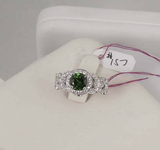 LADIES FINE 18K W.G., GREEN TOURMALINE & DIAMOND RING: An antique style white gold setting with swirling rows set with fine full cut round diamonds totaling approx. 1.24 cts. Ring completed with a center green tourmaline with fine color weighing approx.