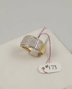 LADIES 14K Y.G. & DIAMOND BAND RING: A yellow gold band is set with many rows of fine full cut round diamonds totaling approx. 1.25 cts.