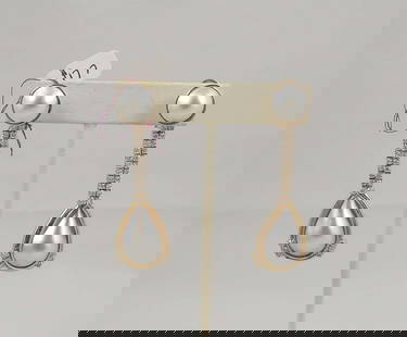PAIR VINTAGE 14K Y.G., MABE PEARL & DIAMOND EARRINGS: Dangle earrings with a round mabe pearl top and a pear shaped mabe pearl dangle. Earrings with two rows of full cut round diamonds totaling approx. 2 cts. Earrings 2 1/2" long.