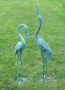 PAIR LIFE SIZE BRONZE SCULPTURES/FOUNTAINS CRANES: Fine aged patina. Very fine detail. Water emerges from each cranes mouth when used as a fountain. Tallest 58 1/2" high.