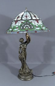 VERY UNUSUAL FIGURAL LAMP WITH LEADED GLASS SHADE.