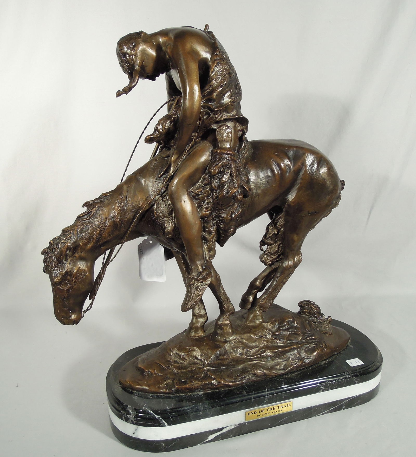 BRONZE SCULPTURE "END OF THE TRAIL" AFTER JAMES EARLE FRASER: Very fine detail. Brown patina. Marble base. Signed. 21" high, 20 1/2" wide.