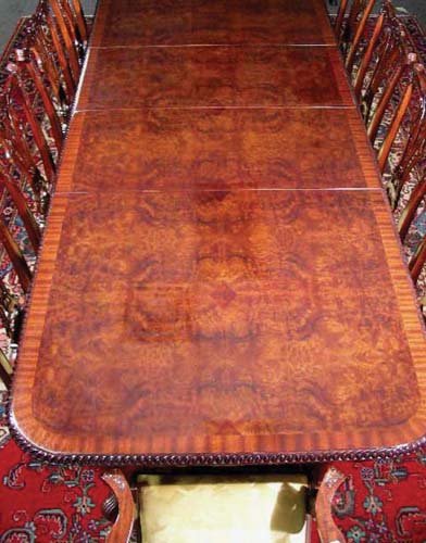 ENGLISH HAND CARVED MAHOGANY AND BURL WOOD DINING R: ENGLISH HAND CARVED MAHOGANY AND BURL WOOD DINING ROOM TABLE AND CHAIRS (SEE PHOTO) Table with scalloped edge. Two leaves included. Lot completed with ten hand carved Chippendale style mahogany and up
