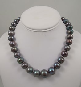 LADIES 18K W.G. STRAND OF LARGE BLACK BAROQUE PEARLS