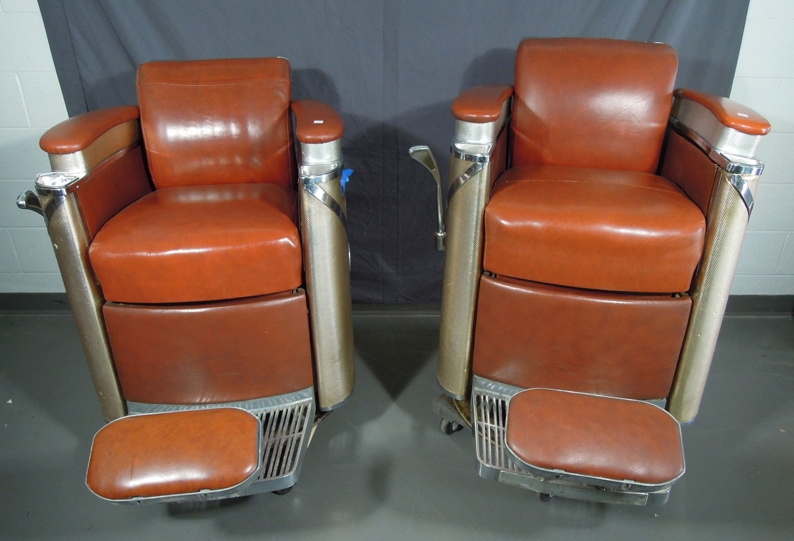 PAIR KOKEN PRESIDENTIAL BARBER CHAIRS: Circa 1950'. Good condition. Both chairs missing headrest.