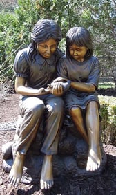 LIFESIZE BRONZE SCULPTURE OF TWO CHILDREN HOLDING BIRD