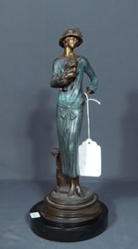 BRONZE SCULPTURE OF "FASHION LADY WITH YORKIE"