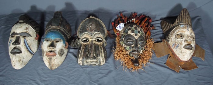 GROUP OF FIVE VINTAGE CARVED WOOD AFRICAN MASKS