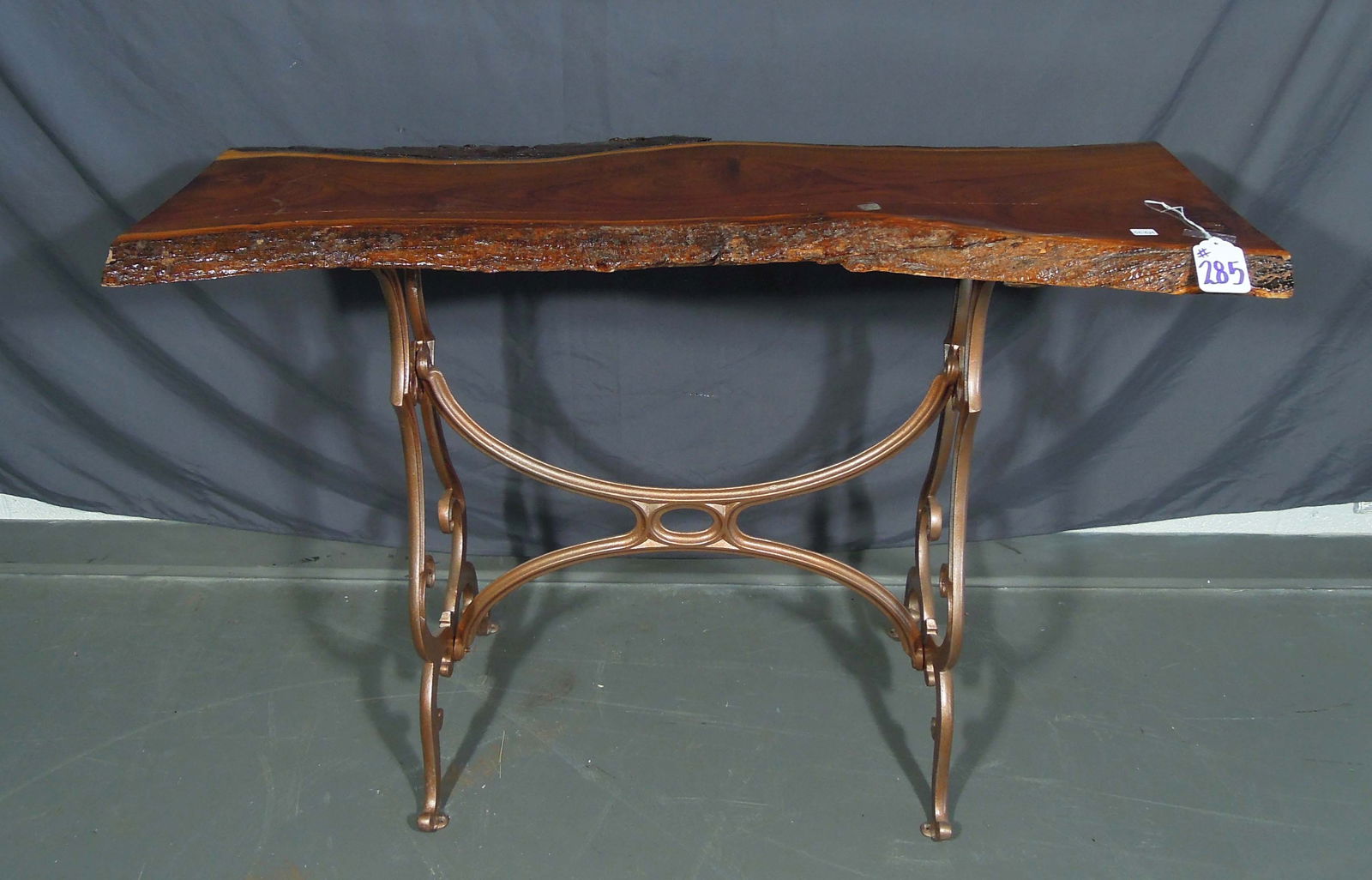LIVE EDGE CONSOLE TABLE WITH CAST IRON BASE: Very good condition. 30 1/2" high, 44 1/4" wide, 16" deep.