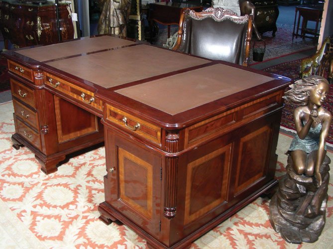 HAND CARVED ENGLISH MAHOGANY PARTNER'S DESK WITH LEATHE: HAND CARVED ENGLISH MAHOGANY PARTNER'S DESK WITH LEATHER TOP (SEE PHOTO) Each side of desk with six drawers and one door which opens to reveal storage. Inlay on fronts and sides of desk. Three section