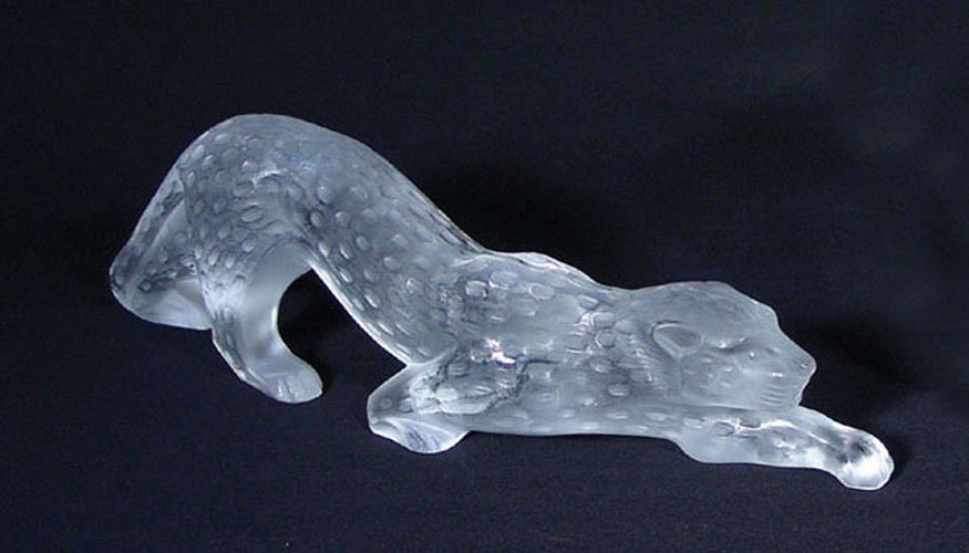 CLEAR CRYSTAL LALIQUE PANTHER "ZEILA": CLEAR CRYSTAL LALIQUE PANTHER "ZEILA" (SEE PHOTO) Signed on foot. Retail $2,500.00. Excellent condition. 4 1/2" high, 14 1/2" long