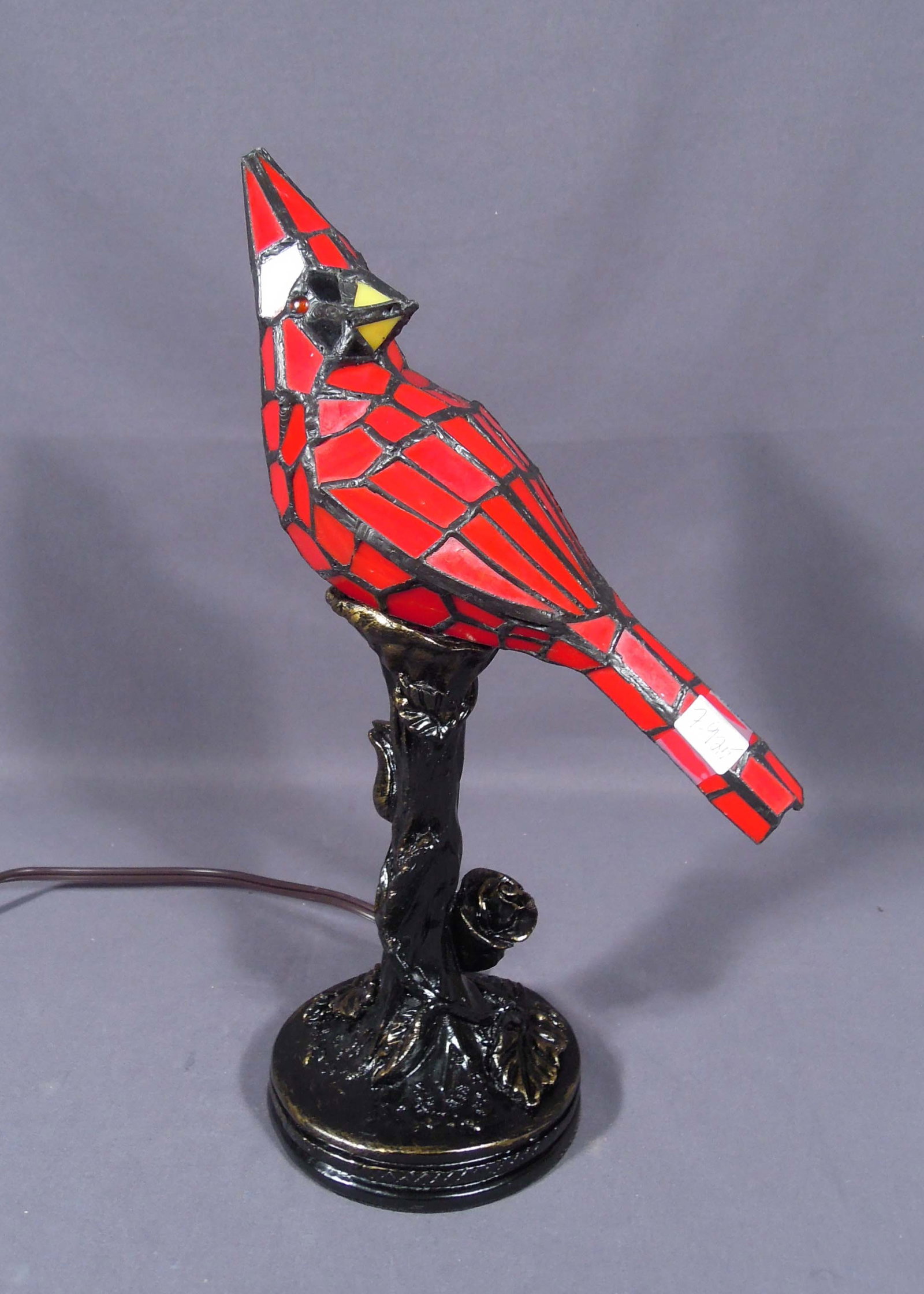 FINE COMPOSITION & LEADED GLASS CARDINAL TABLE LAMP: Cardinal is perched on branch. 13 1/2" high.