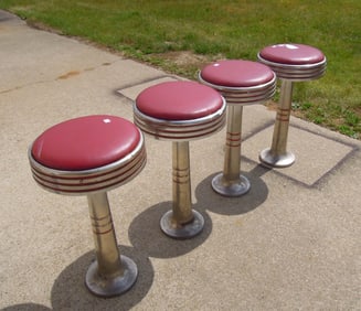 SET OF FOUR 1950'S STAINLESS STEEL DINER BAR STOOLS