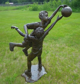 VINTAGE LIFE SIZE BRONZE SCULPTURE OF TO BOYS PLAYING BASKETBALL