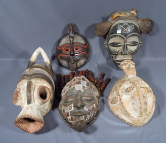 GROUP OF FIVE VINTAGE HAND CARVED WOODEN AFRICAN MASKS