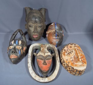 GROUP OF FIVE VINTAGE HAND CARVED WOODEN AFRICAN MASKS