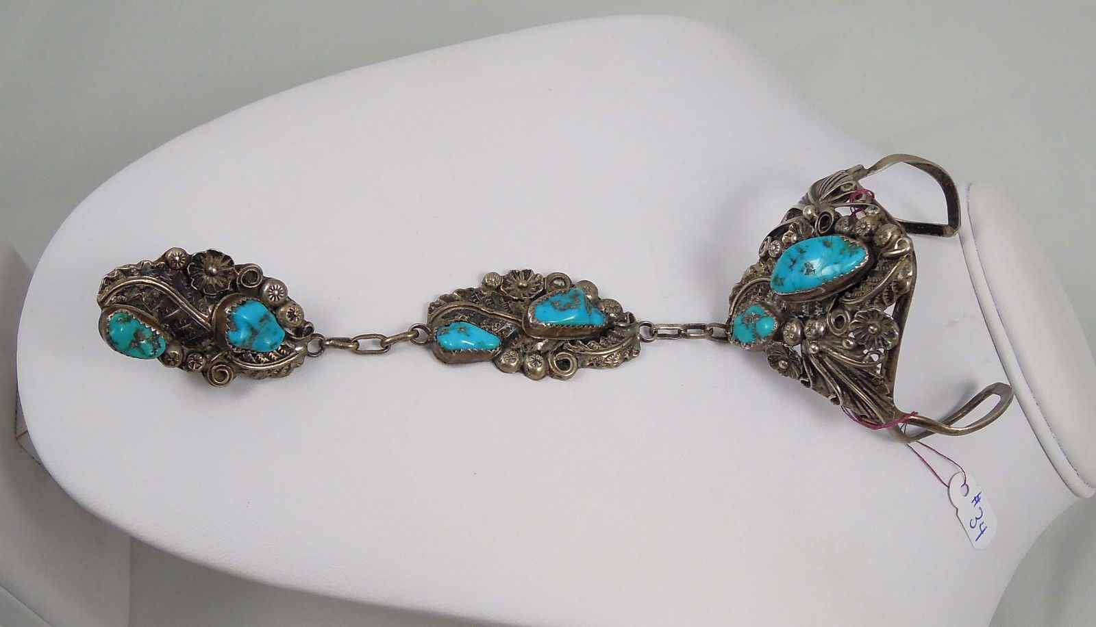 VINTAGE NATIVE AMERICAN NAVAJO TURQUOISE & STERLING SILVER SLAVE BRACELET: Very fine workmanship. If disconnected would be bracelet, pendant and ring. Signed by the artist H.B.Y. Weighs 64.5 grams. 7 1/4" long.