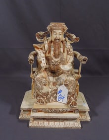 HAND CARVED BONE SCULPTURE OF EMPEROR ON THRONE