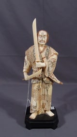 HAND CARVED BONE SCULPTURE OF SAMURAI