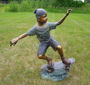 LIFE SIZE VINTAGE BRONZE SCULPTURE OF BOY RIDING SKATEBOARD