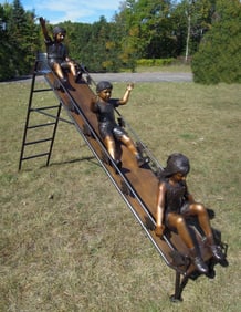 SPECTACULAR BRONZE SCULPTURE OF THREE CHILDREN ON SLIDE