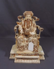 HAND CARVED BONE SCULPTURE OF EMPEROR ON THRONE