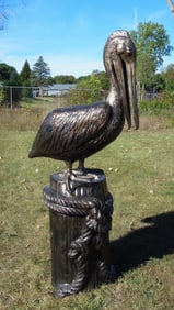 MONUMENTAL BRONZED ALUMINUM SCULPTURE OF PELICAN STANDING ON DOCK POST