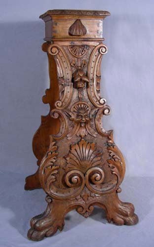 FINE ITALIAN ANTIQUE WALNUT CANDLE STAND: FINE ITALIAN ANTIQUE WALNUT CANDLE STAND A pyramid style candle holder with very fine carvings of bust and fruit. Circa 1870's. 33" high, 18 1/2" wide, 17" deep