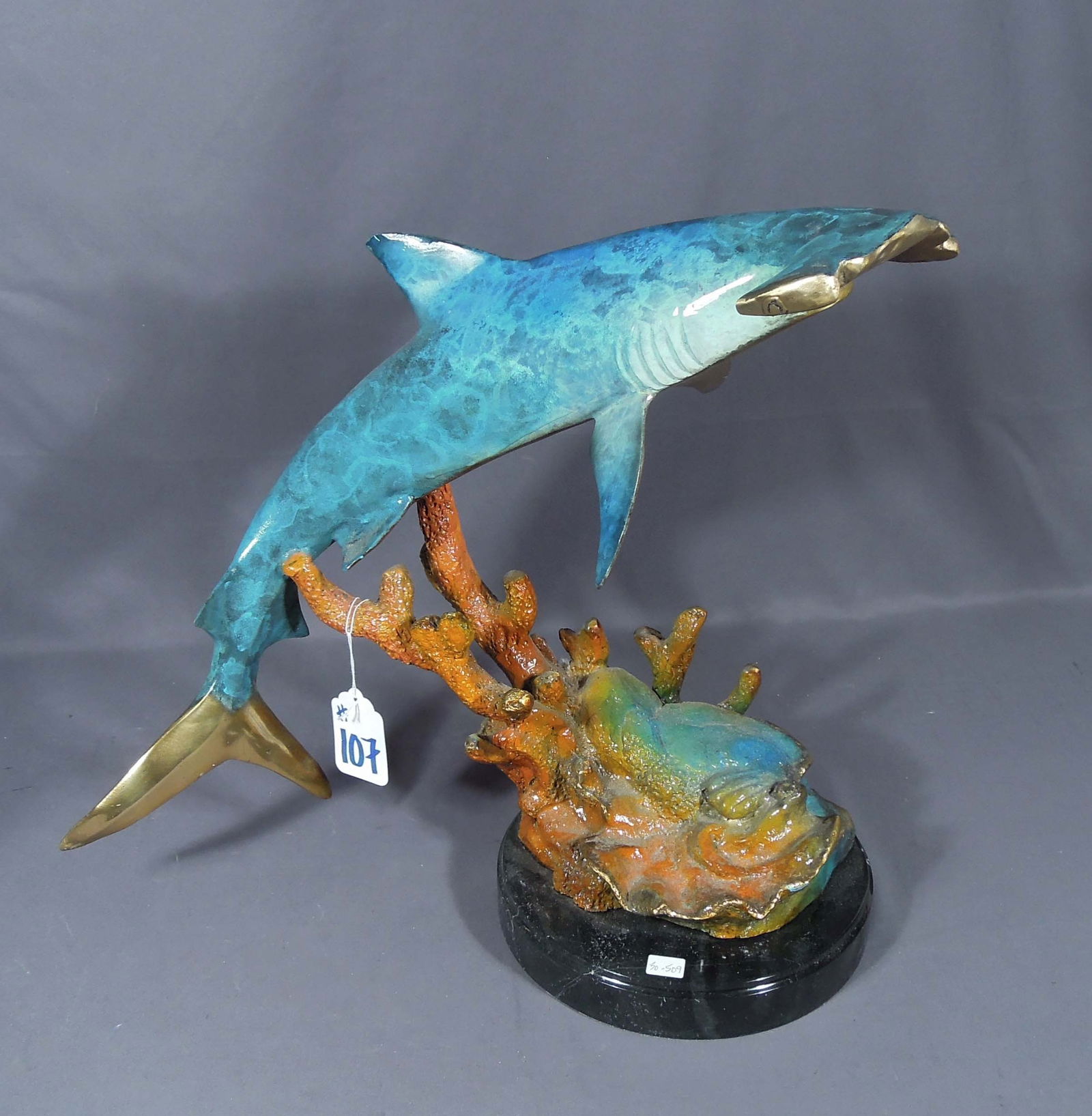SPECTACULAR BRONZE SCULPTURE OF HAMMERHEAD SHARK: Excellent detail. Four color patina. Marble base. 19 1/2" high, 21" wide, 10" deep.