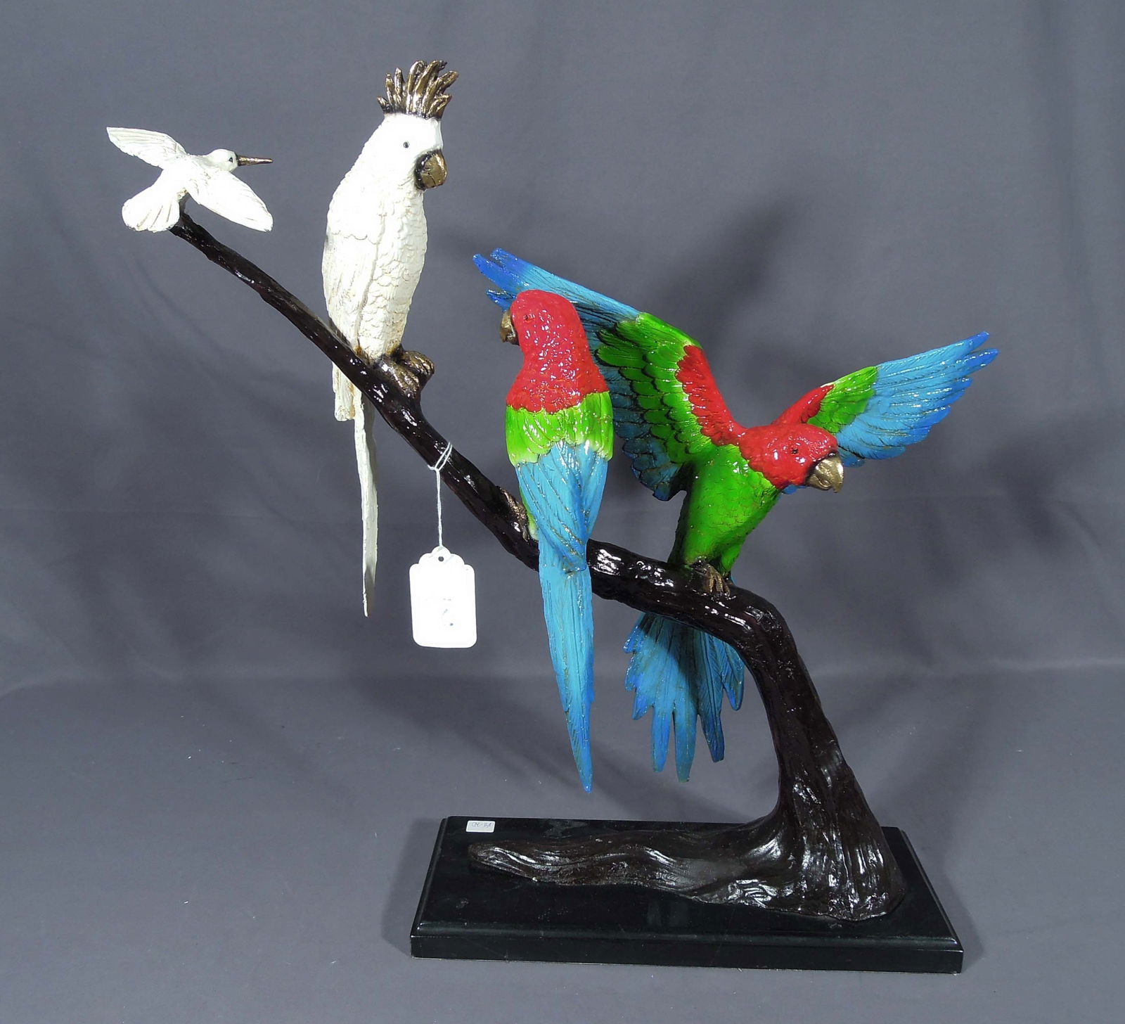 BRONZE SCULPTURE OF TWO PARROTS AND HUMMINGBIRD ON TREE BRANCH: Excellent detail. Vibrant colors. 23" high, 24" wide, 6 1/2" deep.