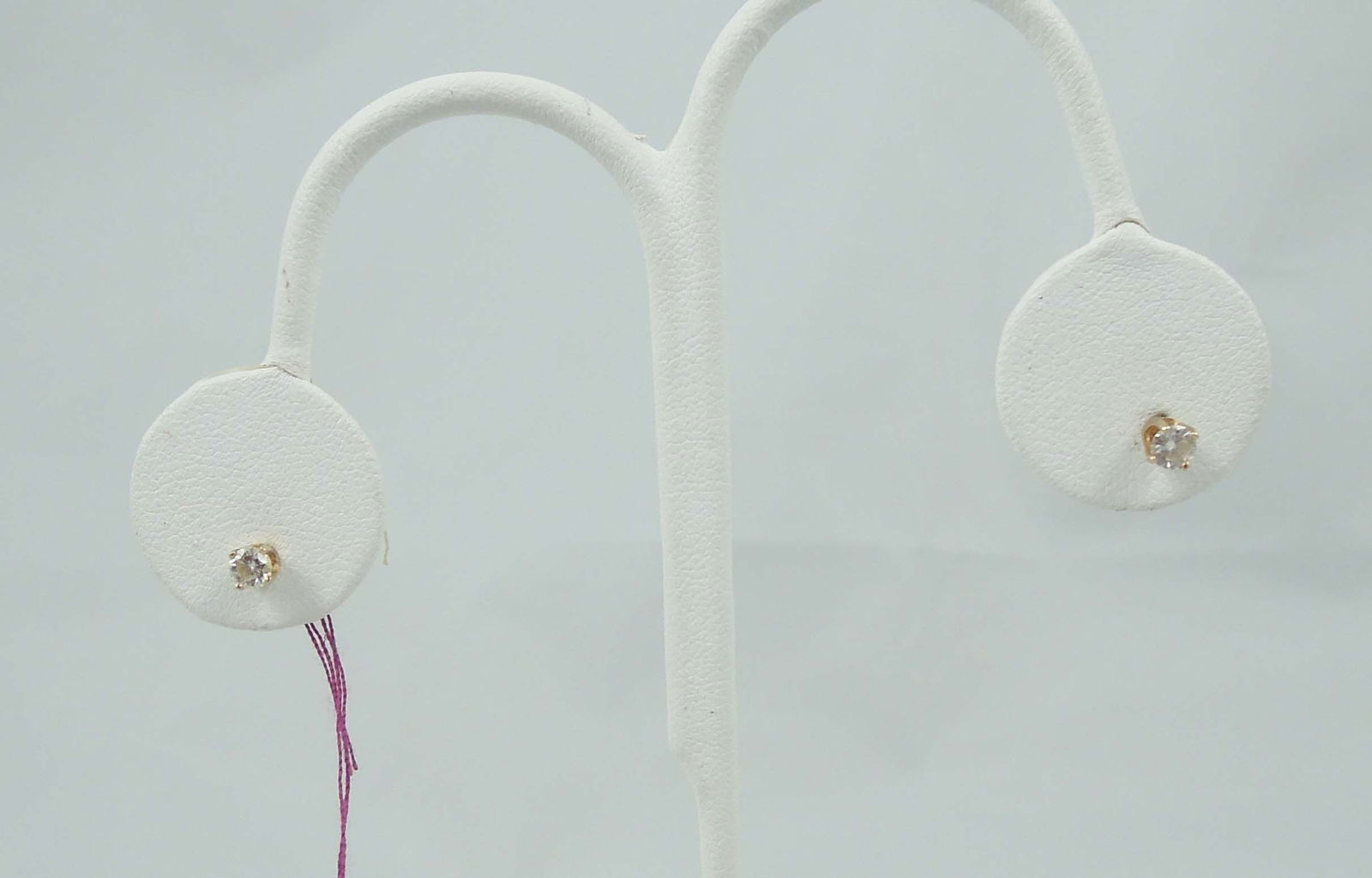 PAIR LADIES 14K Y.G. & DIAMOND STUD EARRINGS: A yellow gold mount set with a full cut round diamond. Total diamond weight approx. .30 ct. (.15 ct each).