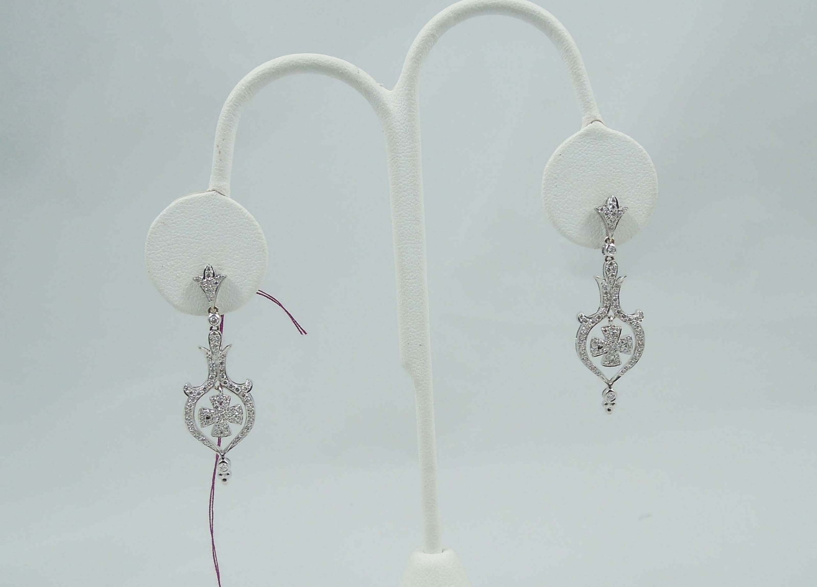 PAIR LADIES FINE 14K W.G. & DIAMOND DANGLE EARRINGS: Dangle with ornate drop with a center diamond set cross. Total diamond weight approx. .75 ct.