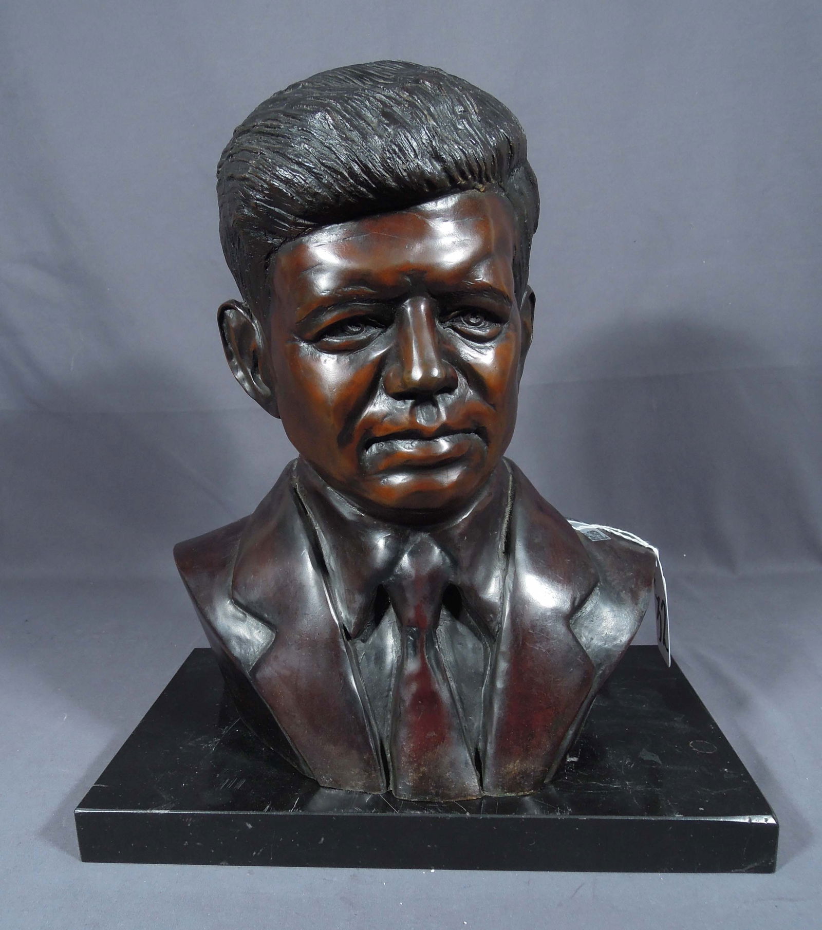 VERY HEAVY VINTAGE BRONZE BUST OF JOHN F. KENNEDY: Excellent detail. Foundry mark on back and signed Magnus. Black marble base. 16" high, 14 1/2" wide, 9 1/2" deep.