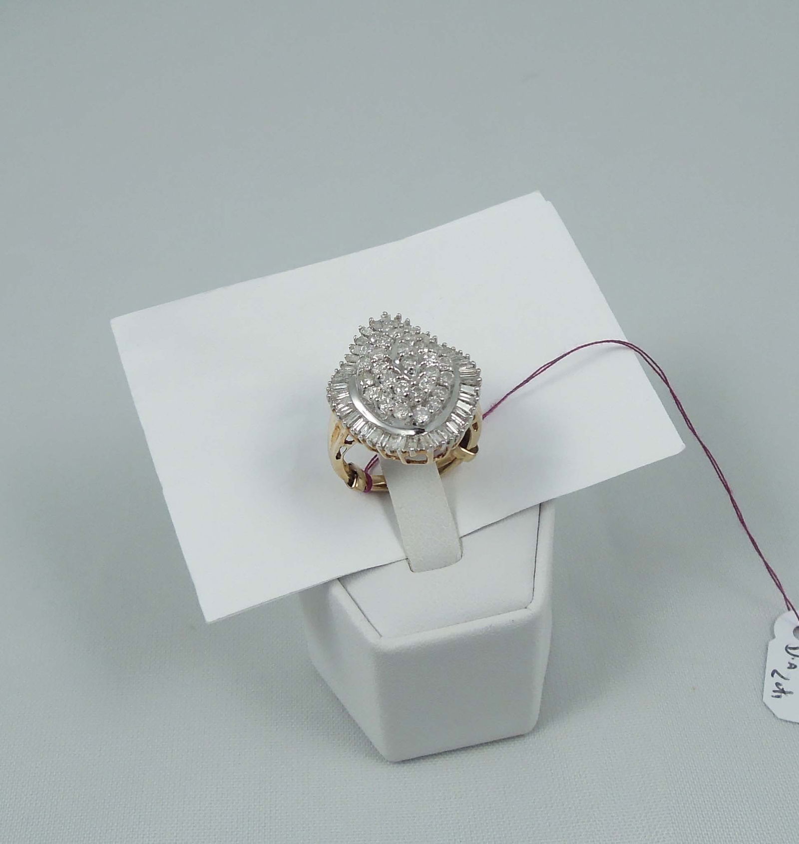 LADIES 14K Y&W GOLD & DIAMOND RING: A two tone band set with a center section set with full cut round dilamonds. Ring set with an outer row of baguette cut diamonds. Total diamond weight approx. 2 cts. Ring weighs 6.6 grams.