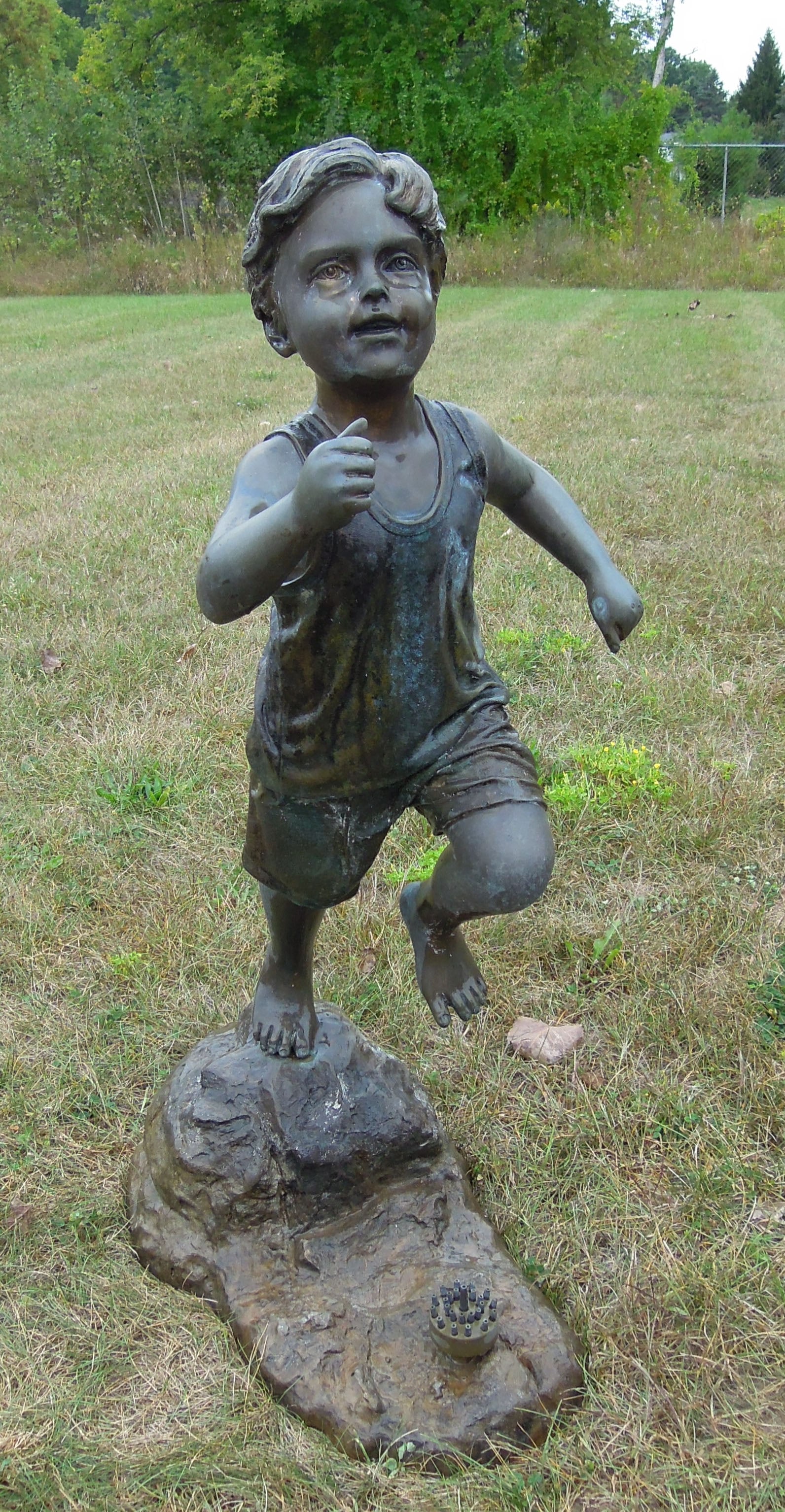 HEAVY VINTAGE LIFE SIZE BRONZE SCULPTURE/FOUNTAIN OF YOUNG BOY RUNNING THROUGH SPRINKLER: Excellent detail. Great aged patina. 42" high, 18" wide, 26" deep.
