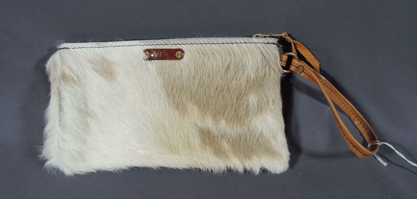 HAND CRAFTED COW HIDE WRISTLET: Brand new & excellent quality. 5 1/2" high, 10" wide.