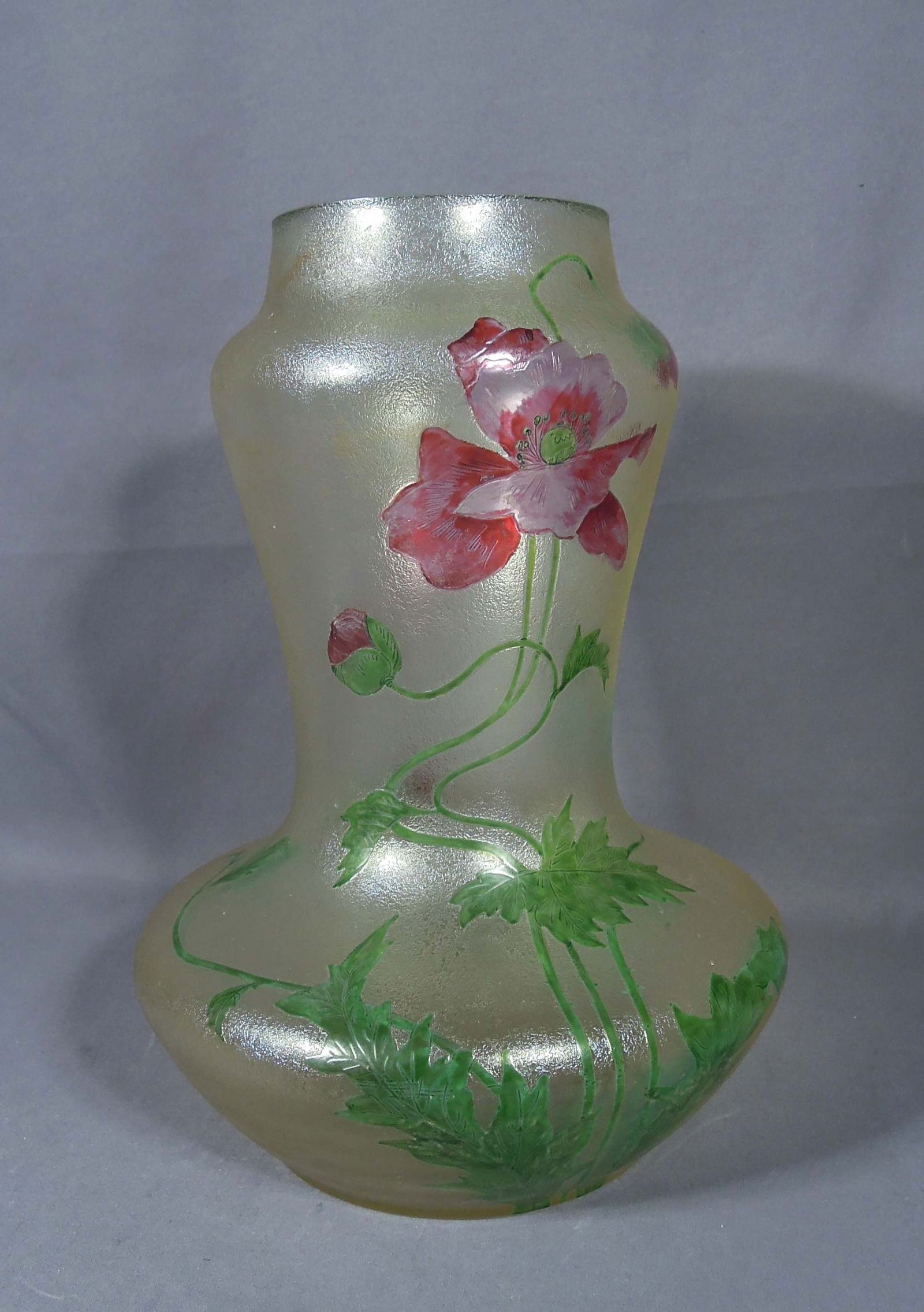 ANTIQUE FRENCH ART NOUVEAU DAUM NANCY ART GLASS VASE: A beautiful vase featuring enameled floral decoration with pink poppies on a satin glass finish. Signed on base "Daum Nancy, France". 12 1/4" high, 8 1/4" dia.